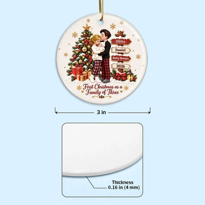 Personalized First Christmas Ceramic Ornament, Parents Cuddling Baby by a Christmas Tree, Creative Gift for New Parents