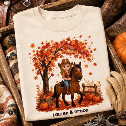 Personalized Classic Tee with Cartoon Cowgirl Riding a Horse in an Orange Fall Scene, Creative Gift for Horse Lovers