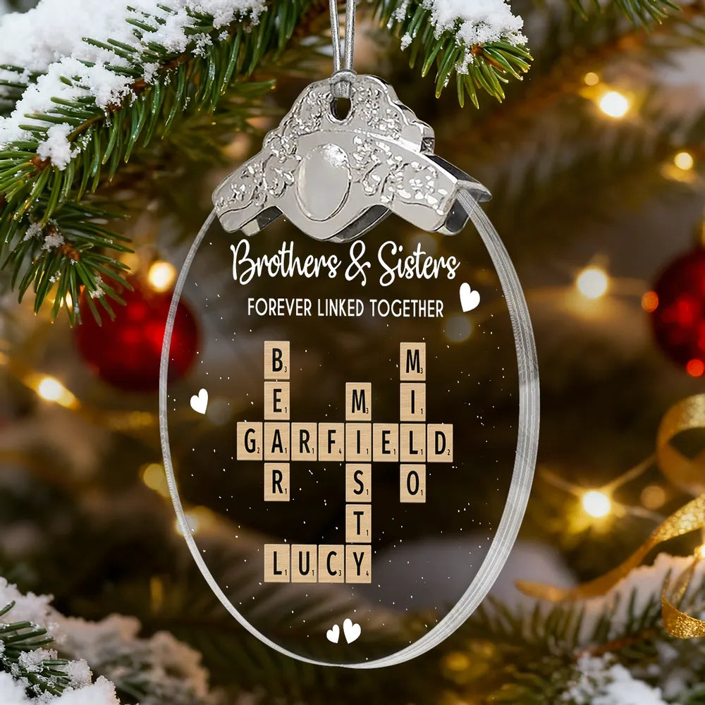 Silver Capped Glass Ornament with siblings crossword tiles, cozy tree display, warm family keepsake, gift-ready decoration for Christmas gatherings