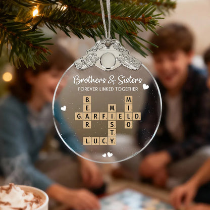 Silver Capped Glass Ornament with siblings crossword tiles, cozy tree display, warm family keepsake, gift-ready decoration for Christmas gatherings