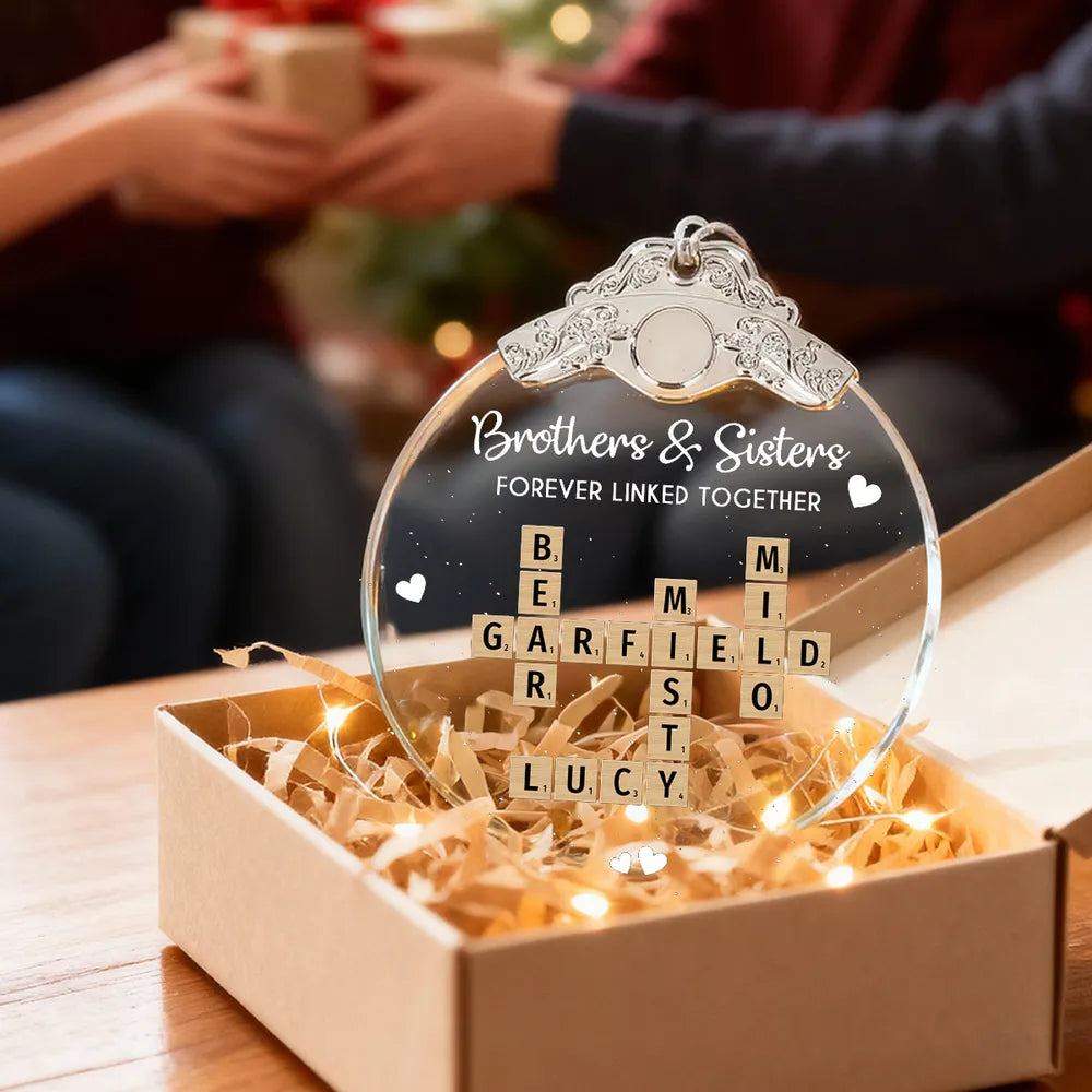 Silver Capped Glass Ornament with siblings crossword tiles, cozy tree display, warm family keepsake, gift-ready decoration for Christmas gatherings