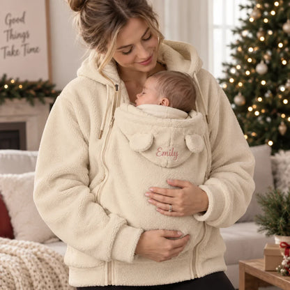 Personalized Embroidered Fleece Babywearing Hoodie, Mom Cuddling Baby in a Christmas Living Room, Unique Gift